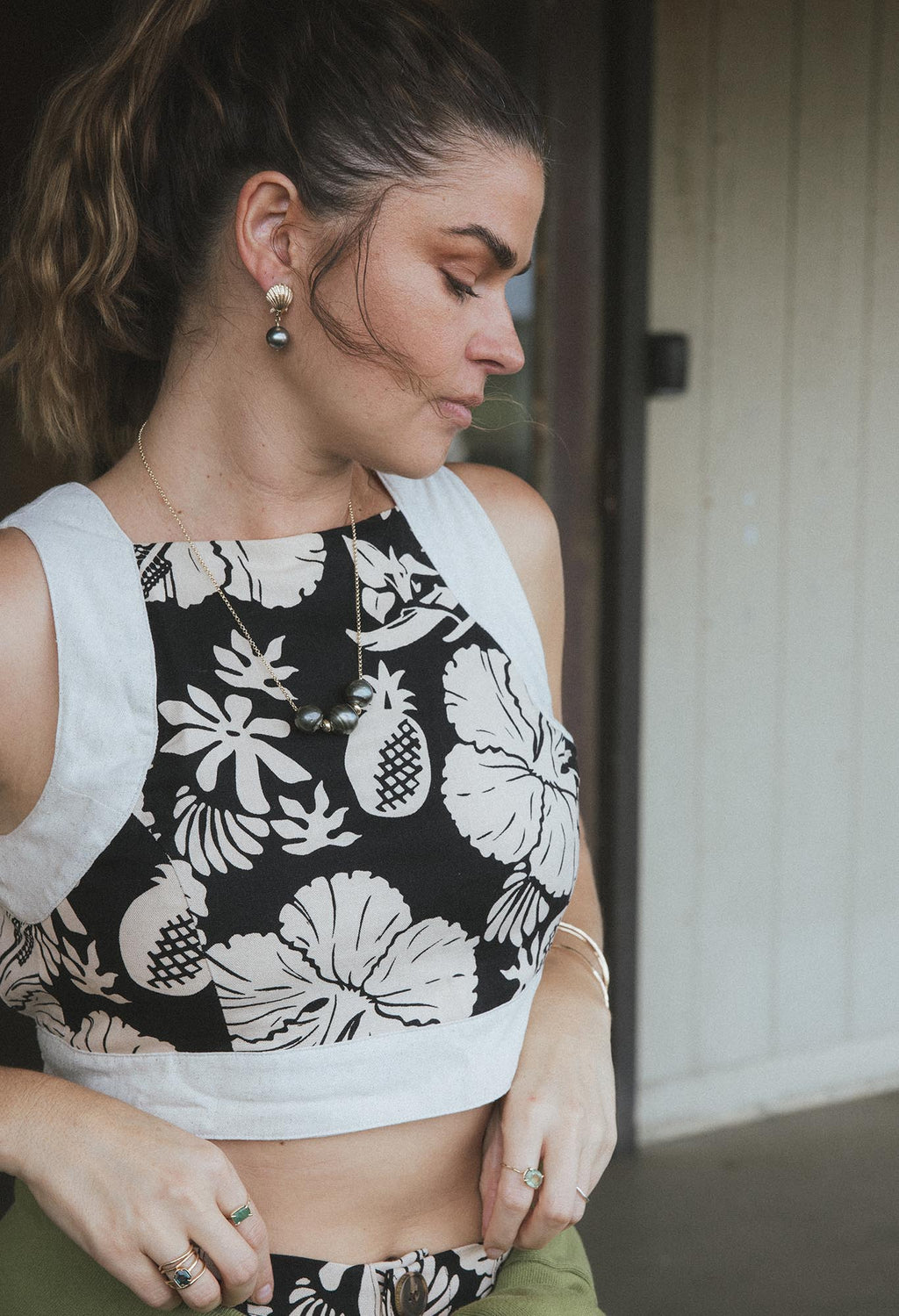 Wings Hawaii pinafore crop top in Hana Nightfall. Black and tan aloha print clothing handmade in Maui. 