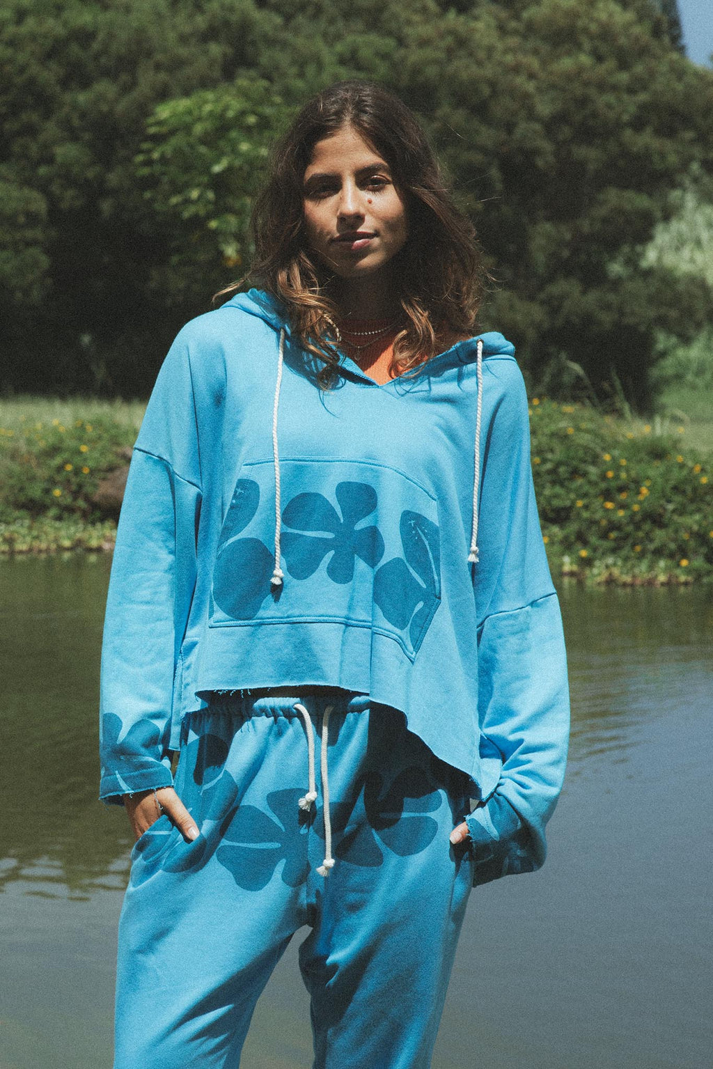Wings Hawaii beach hoodie in blue crush hibiscus print. Designed in Maui, sewn in Bali. Cozy french cotton terry, drawstring hood, front kangaroo pouch, wide sleeves. Coastal chic surfer girl vibes. 