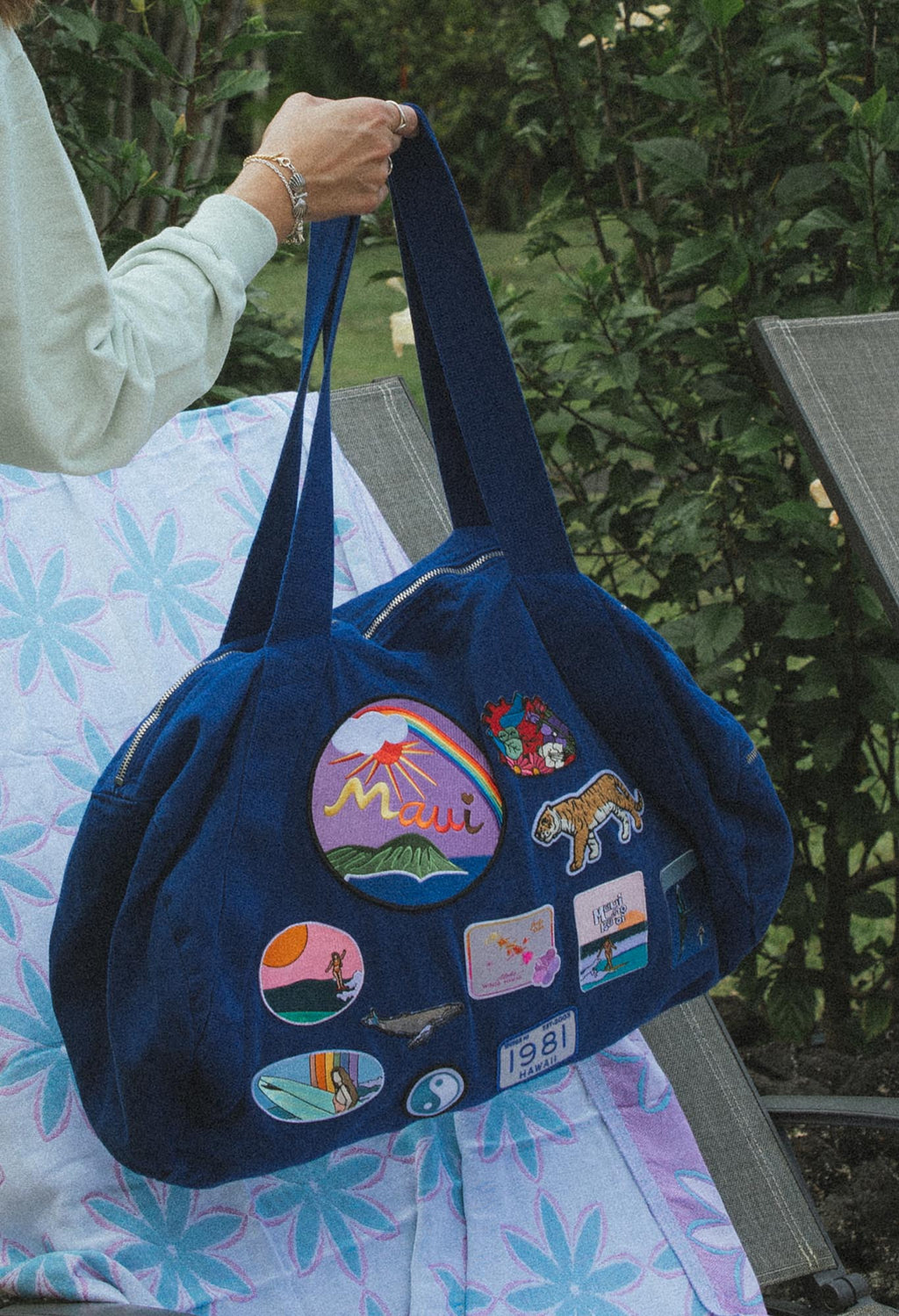 Wings Hawaii patched up cotton duffel bag in blue. Original artwork on embroidered patches - mermaids, surfer girls, whales, tigers, rainbows and more. Handmade with aloha in Maui. 