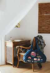 Wings Hawaii patched up cotton duffel bag in blue. Original artwork on embroidered patches - mermaids, surfer girls, whales, tigers, rainbows and more. Handmade with aloha in Maui.  thumbnail