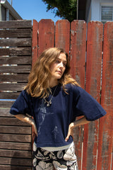 Wings Hawaii whale dance wide cropped tee in blue. Original humpback whale artwork designed and hand-printed in Maui. 