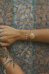 Wings Hawaii Sunrise Shell Cuff. Authentic Hawaiian beach shell on sterling silver bracelet. Fine jewelry handmade with aloha on Maui. One of a kind gifts made in Hawaii.  thumbnail
