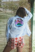Wings Hawaii vintage collage chambray cropped shirt with Maui island artwork on back and Hawaii design on front. Upcycled and handmade in Maui. Sustainable, small batch, slow fashion handcrafted with aloha in Hawaii. 