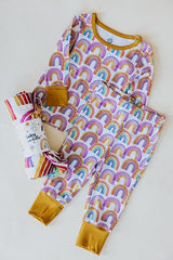 Wings Hawaii rainbow keiki pajamas shown with rainbow baby swaddle thumbnail