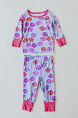 Wings Hawaii Hibiscus print kids pajamas set. Original artwork designed in Maui. Island style keiki gifts. Long sleeved shirt with pajama pants. Small batch, sustainable, unique children’s apparel. 