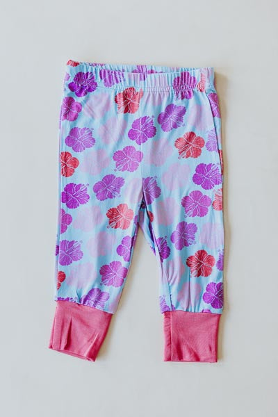 Wings Hawaii Hibiscus print kids pajamas set. Original artwork designed in Maui. Island style keiki gifts. Long sleeved shirt with pajama pants. Small batch, sustainable, unique children’s apparel. 