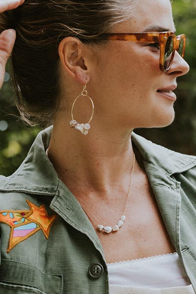 model wearing Wings Hawaii Shell Lei Hoop Earrings - Pink Pearl