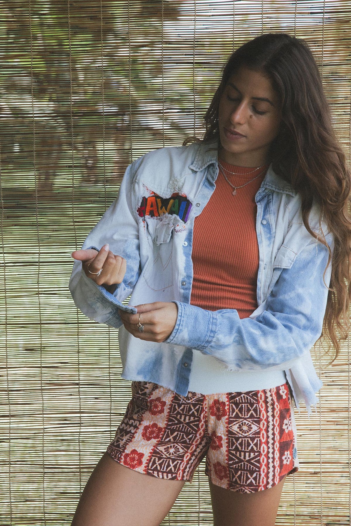 Wings Hawaii vintage collage chambray cropped shirt with Maui island artwork on back and Hawaii design on front. Upcycled and handmade in Maui. Sustainable, small batch, slow fashion handcrafted with aloha in Hawaii. 