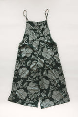 Wings Hawaii women's aloha print overalls in Hana Forest. Designed in Maui, made in Bali. Dark green tropical pattern with hibiscus florals, pineapples, and Hawaiian outrigger canoes. Adjustable straps, wide leg, relaxed fit, front and side pockets. Small batch, sustainable clothing for beachy, boho style.  thumbnail