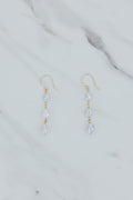 Wings Hawaii drop chain triple pearl earrings in 14k yellow gold. Six total white uncultured Tahitian pearls on dangle earrings. Fine jewelry handmade in Maui. 