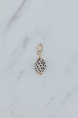 Wings Hawaii drupe shell necklace charm in 14k gold fill. Fine jewelry handmade in Maui. Black and white spotted authentic Hawaiian seashell. 