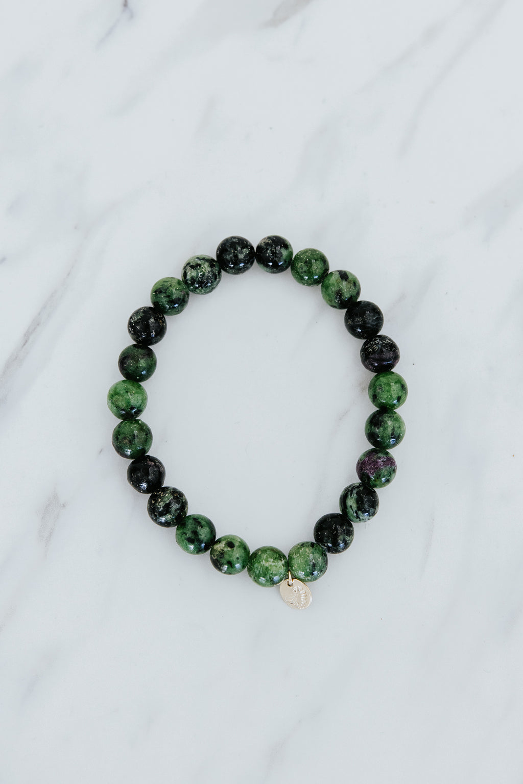 Wings Hawaii emerald crystal stretchy bracelet with 14k gold-fill tag. Boho-chic jewelry handmade in Maui. 