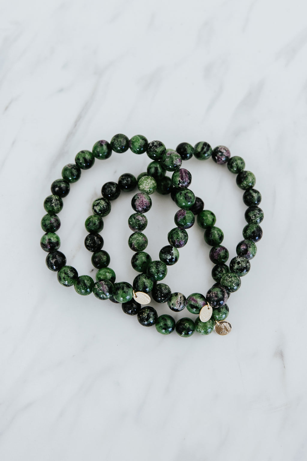 Wings Hawaii emerald crystal stretchy bracelet with 14k gold-fill tag. Boho-chic jewelry handmade in Maui. 