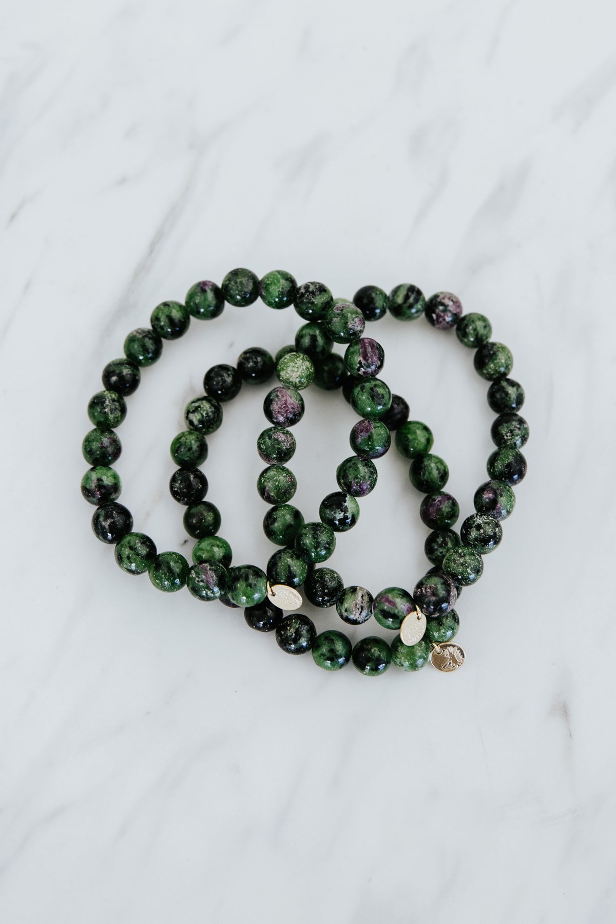 Wings Hawaii emerald crystal stretchy bracelet with 14k gold-fill tag. Boho-chic jewelry handmade in Maui. 