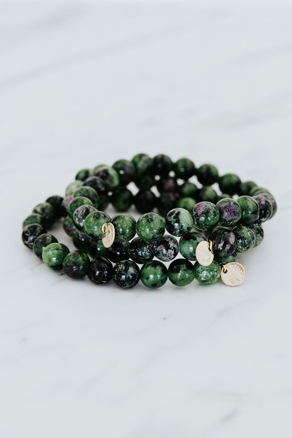 Wings Hawaii emerald crystal stretchy bracelet with 14k gold-fill tag. Boho-chic jewelry handmade in Maui. 