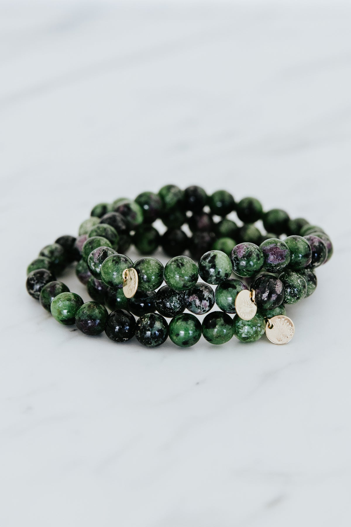 Wings Hawaii emerald crystal stretchy bracelet with 14k gold-fill tag. Boho-chic jewelry handmade in Maui. 