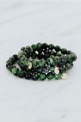 Wings Hawaii emerald crystal stretchy bracelet with 14k gold-fill tag. Boho-chic jewelry handmade in Maui. 