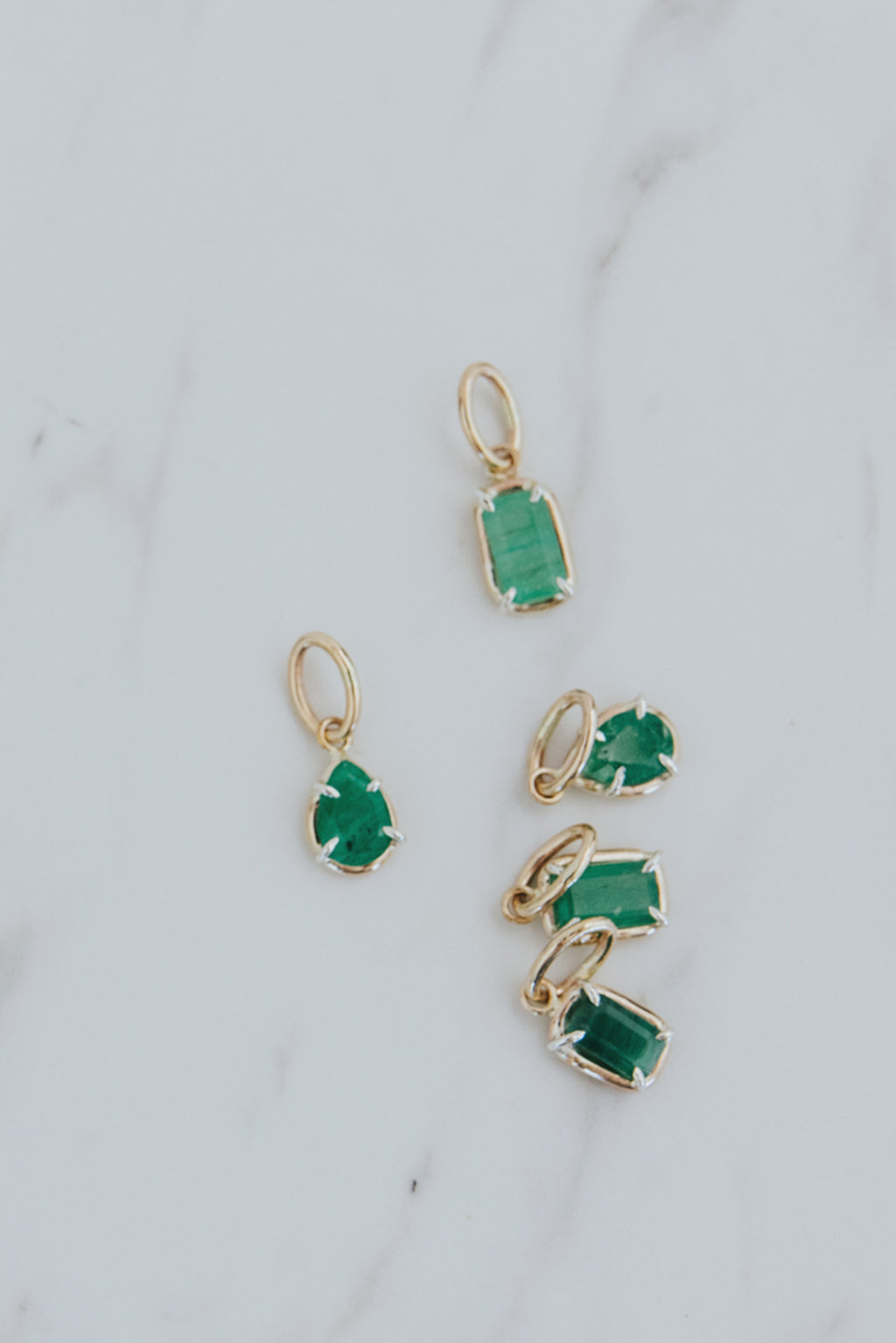 Wings Hawaii emerald green necklace charms in 14k gold-filled and sterling silver mixed metals. Fine jewelry handcrafted in Maui. 