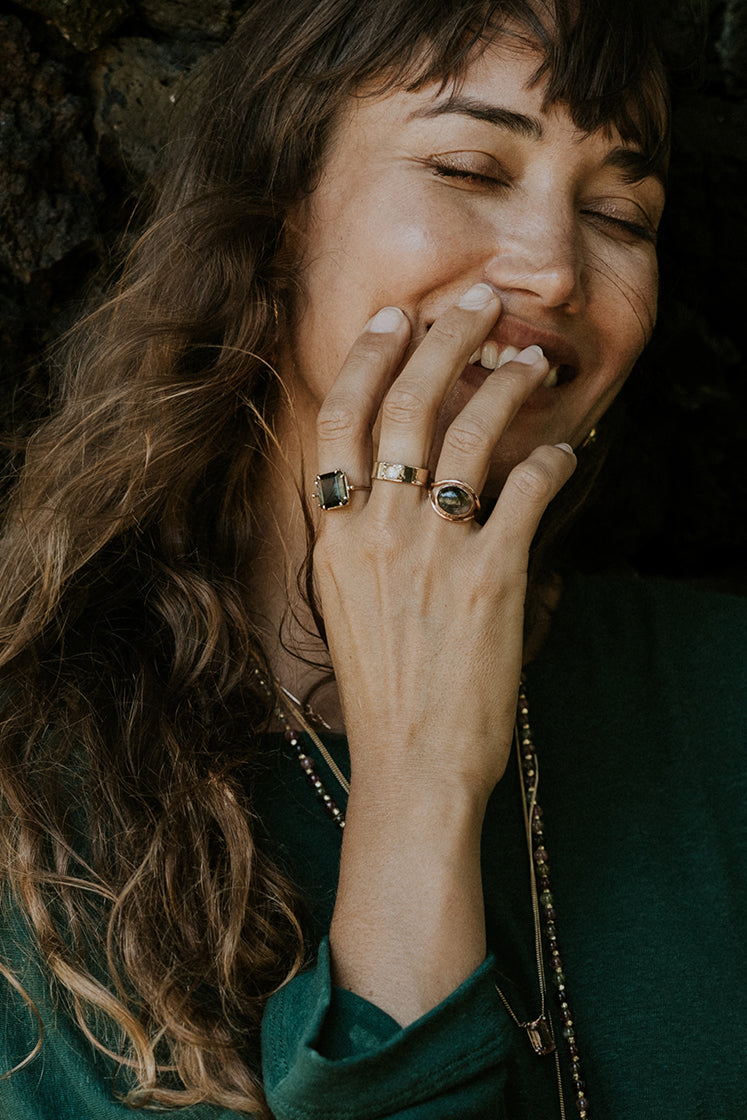 A Tourmaline set in 14K Yellow Gold int he shape of an evil eye