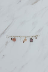 Wings Hawaii Multi Charm Necklace Adapter in sterling silver, with solid 14k rose gold butterfly wing charm, a natural Keshi pearl, a Watermelon Tourmaline slice and teardrop bead, two .81 tcw diamonds. Fine jewelry handmade in Maui. 