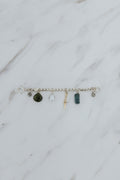Wings Hawaii Multi Charm Necklace Adapter in sterling silver with solid 14k yellow gold dagger charm, natural Keshi pearl, green Tourmaline teardrop bead, and two .95 tcw diamonds.