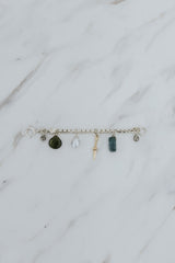 Wings Hawaii Multi Charm Necklace Adapter in sterling silver with solid 14k yellow gold dagger charm, natural Keshi pearl, green Tourmaline teardrop bead, and two .95 tcw diamonds.