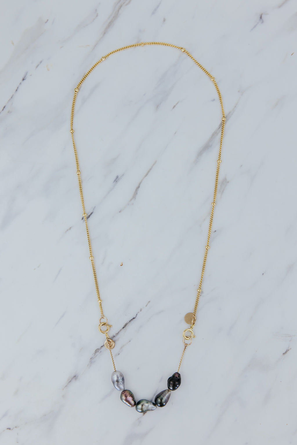 Wings Hawaii Keshi Tahitian Pearl Necklace Extender in 14k gold fill. Clasp on to chain necklaces for a unique charm style. Fine jewelry handmade in Maui. 