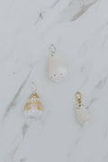 Wings Hawaii cone shell charms for necklaces. Fine shell jewelry handcrafted in Maui. Modern beachy charm necklaces handmade with authentic Hawaiian sea shells. 