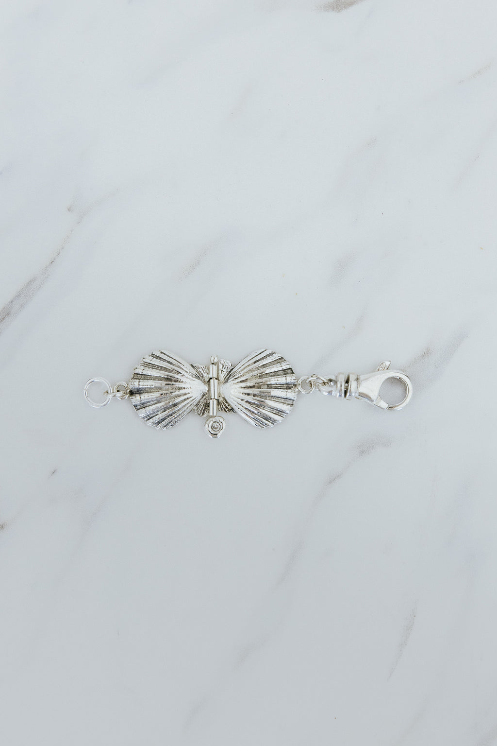 Wings Hawaii Forever Sunrise Shell Hinge Pendant in sterling silver with small diamond. Use as necklace or bracelet extender or clasp-on charm. Fine jewelry handmade in Maui. 