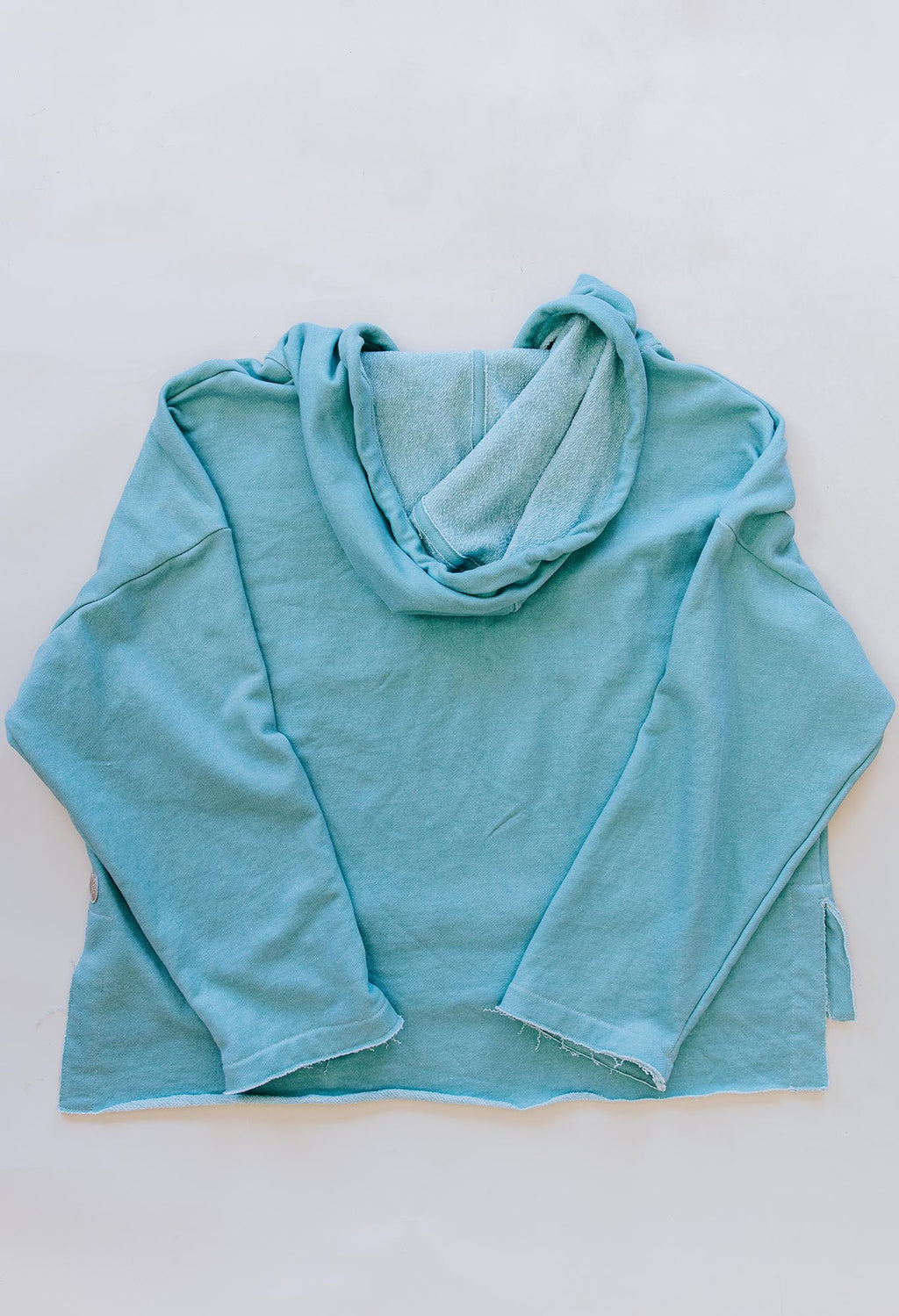 Wings Hawaii Beach Hoodie sweatshirt in aqua blue. 100% cotton french terry. Elevated apparel, sustainable essentials for coastal living. Designed in Maui, sewn in LA. 