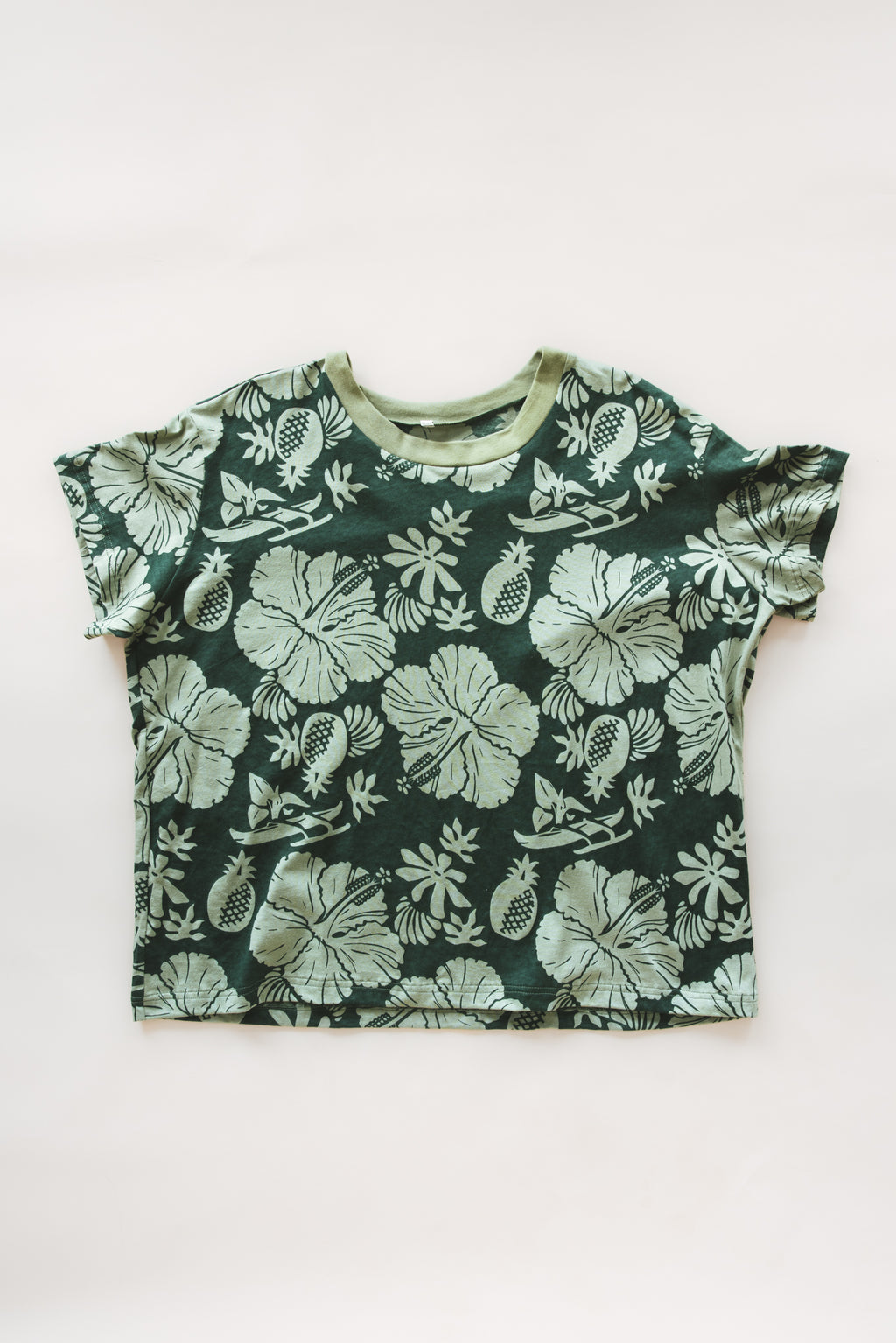 Wings Hawaii women's green Hana Forest aloha print t-shirt in hemp/organic cotton blend. Designed in Maui, made in Bali. Small batch, sustainable apparel for modern tropical lifestyle. 