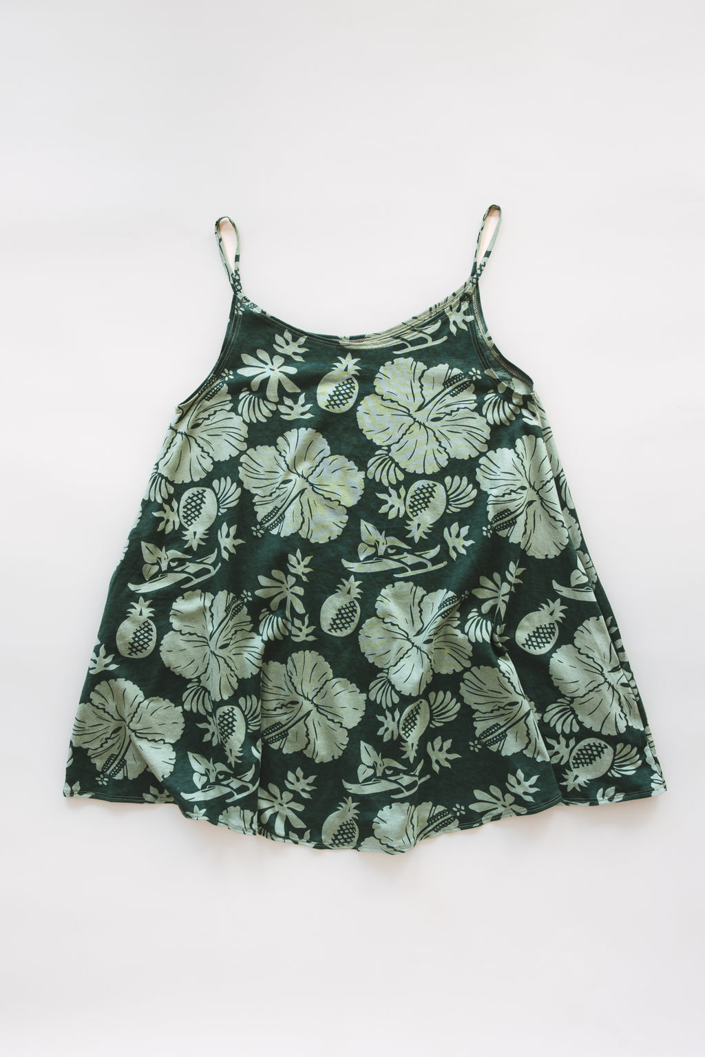 Wings Hawaii hemp trapeze mini dress in Hana Forest green aloha print. A-line, side pockets, scoop neck. Designed in Maui, sewn in Bali. Small batch, sustainable women's apparel from Hawaii. 