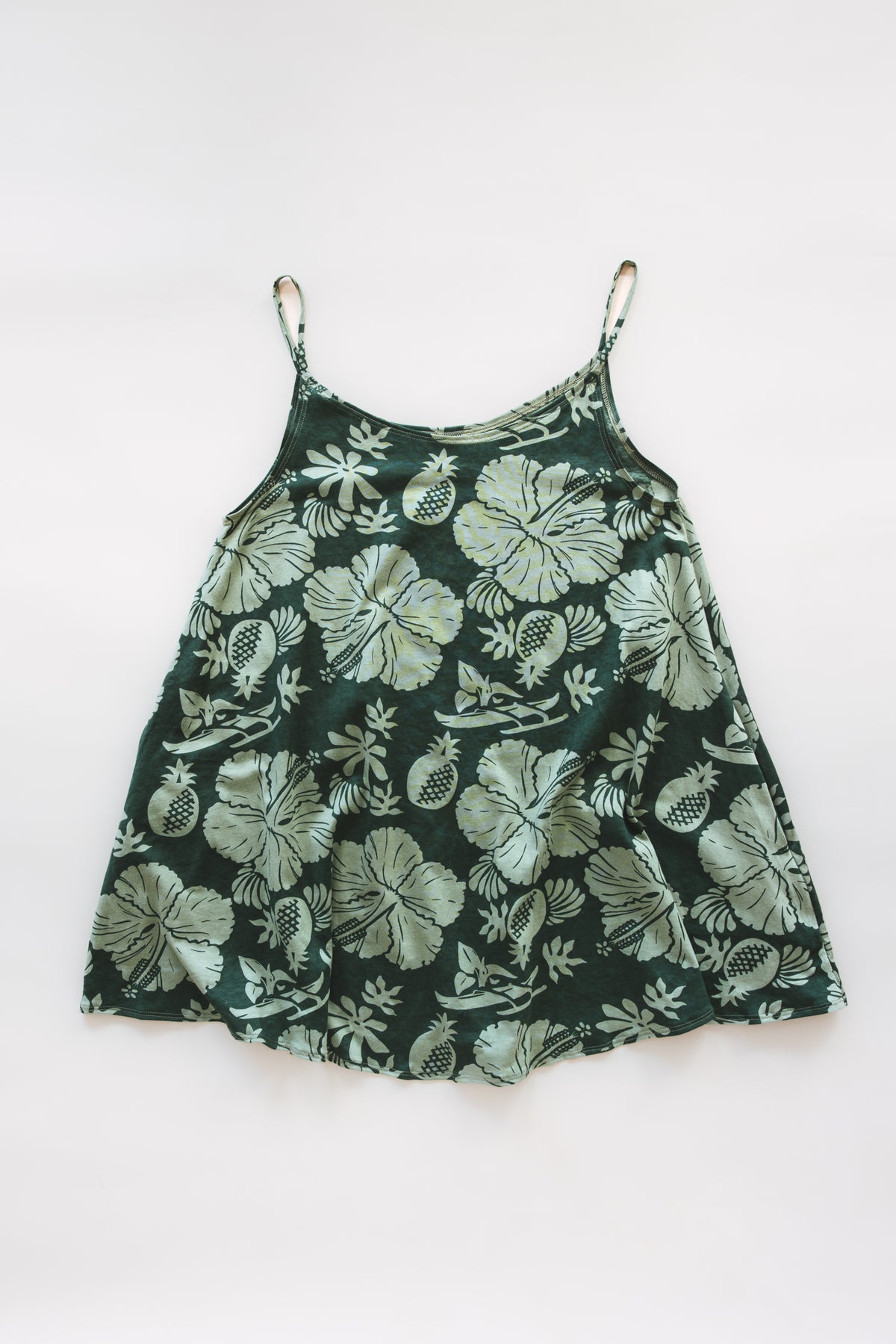 Wings Hawaii hemp trapeze mini dress in Hana Forest green aloha print. A-line, side pockets, scoop neck. Designed in Maui, sewn in Bali. Small batch, sustainable women's apparel from Hawaii. 
