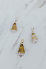 Wings Hawaii purple and green Cone Shell necklace charms in 14k gold-filled or sterling silver. Fine shell jewelry handcrafted in Maui. Modern beachy charm necklaces handmade with authentic Hawaiian sea shells. 