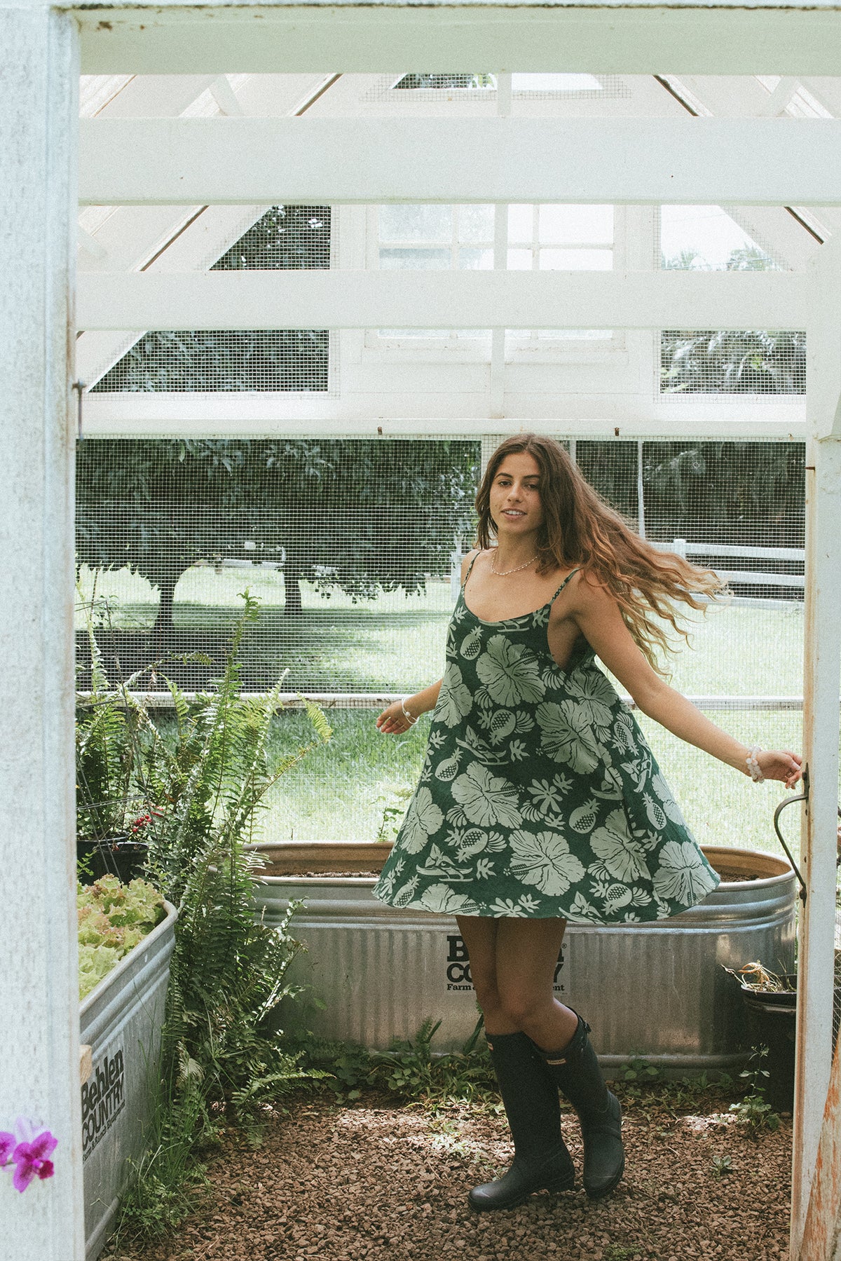 Wings Hawaii hemp trapeze mini dress in green Hana Forest aloha print. A-line, side pockets, scoop neck. Designed in Maui, sewn in Bali. Small batch, sustainable women's apparel from Hawaii. 