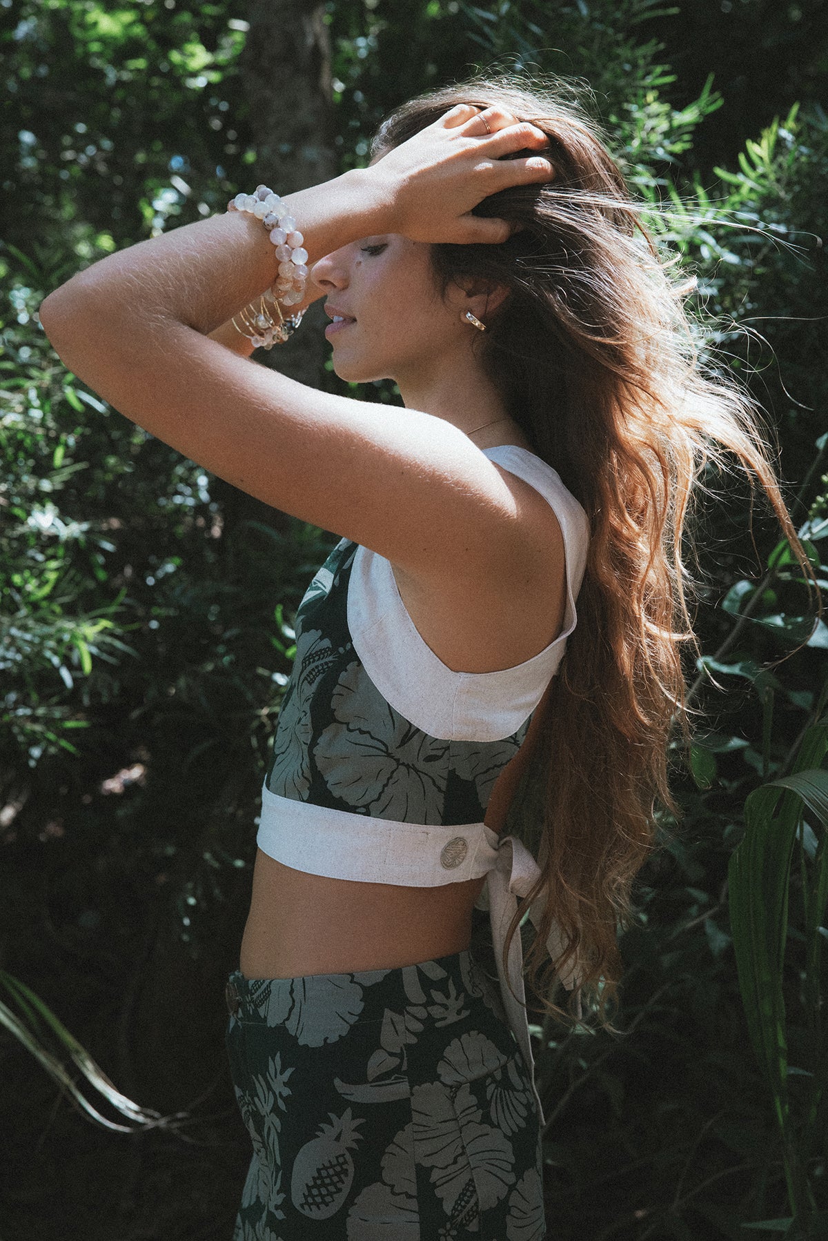 Wings Hawaii pinafore crop top in Hana Forest dark green tropical aloha print. Handmade with aloha in Maui. Small batch, sustainable, slow fashion handcrafted in Hawaii. 