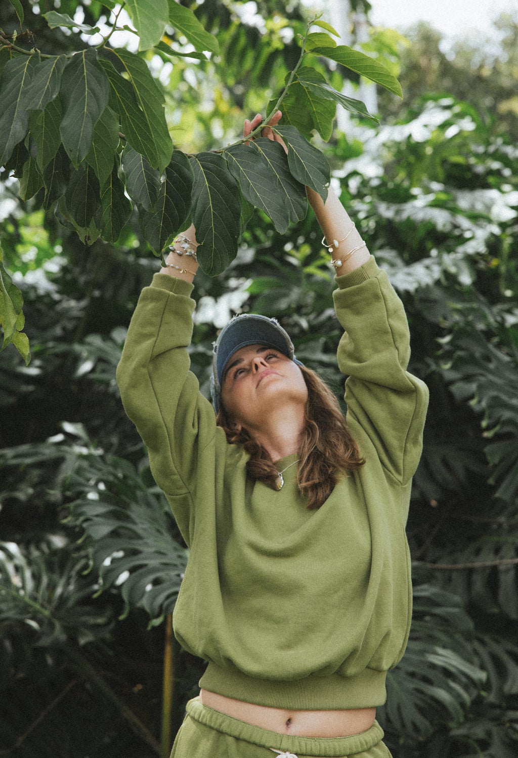 Wings Hawaii Green Sweatshirt in 100% cotton. Designed in Maui, made in Los Angeles, USA. Small batch, sustainable, beach-inspired, elevated essentials. Pair with our green joggers for a matching set.