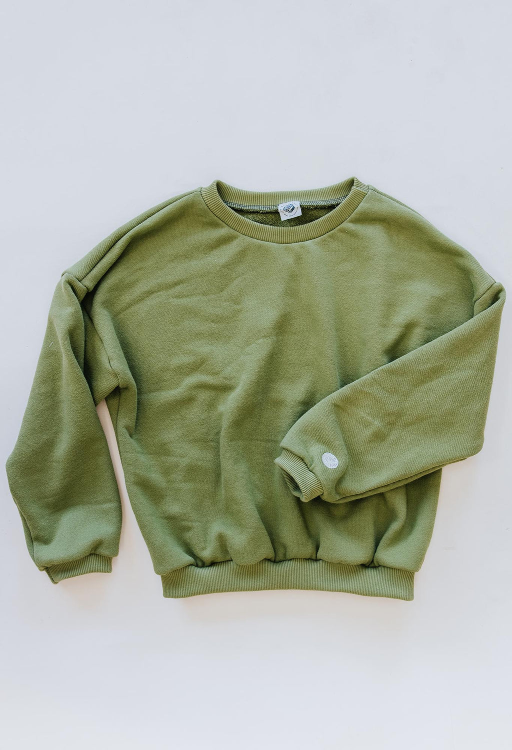 Wings Hawaii Green Sweatshirt in 100% cotton. Designed in Maui, made in Los Angeles, USA. Small batch, sustainable, beach-inspired, elevated essentials. Pair with our green joggers for a matching set.
