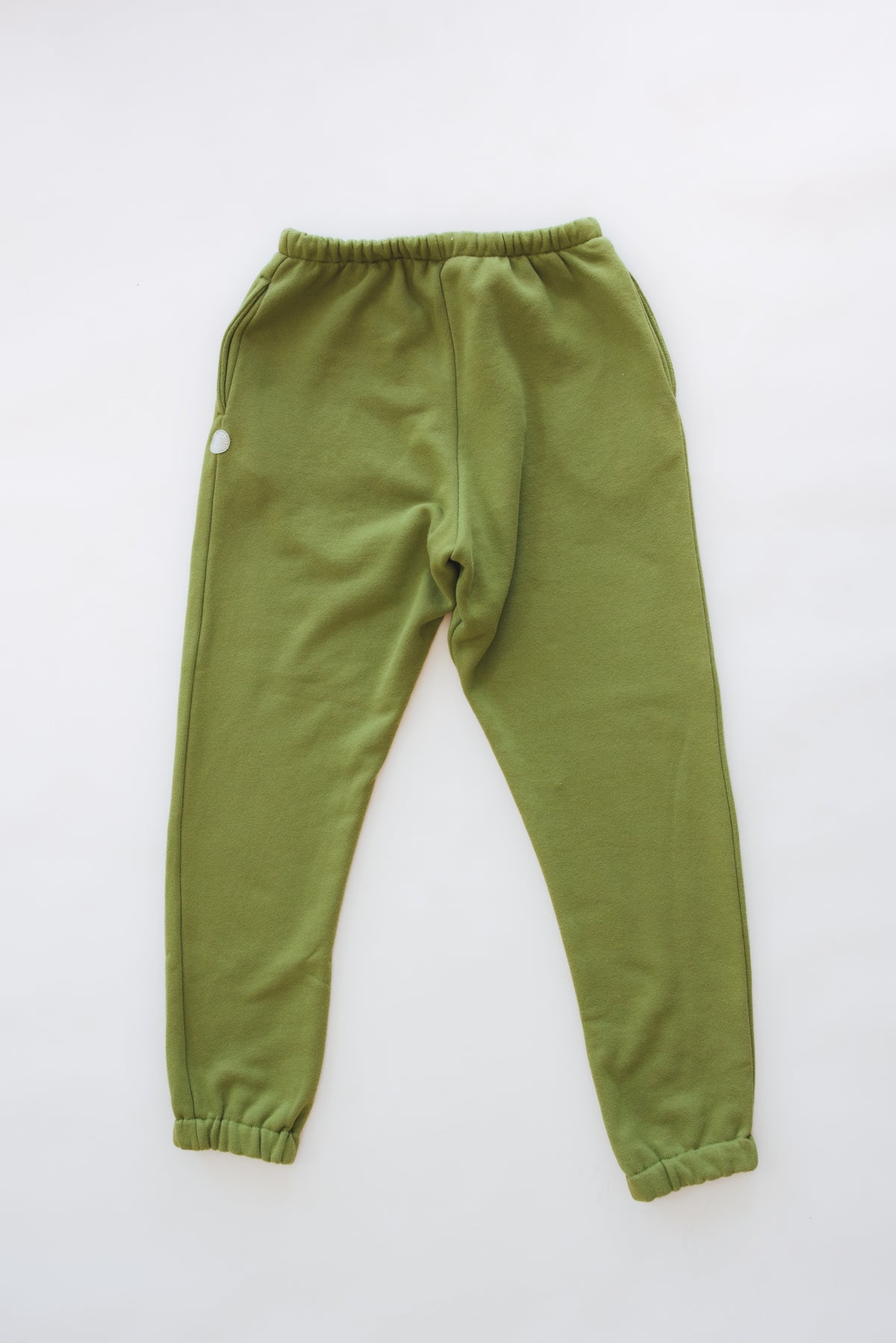 Wings Hawaii Green Joggers in 100% cotton. Designed in Maui, made in Los Angeles, USA. Small batch, sustainable, beach-inspired, elevated essentials. 