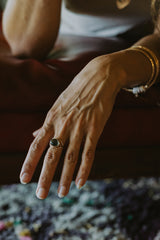 A Tourmaline set in 14K Yellow Gold int he shape of an evil eye thumbnail