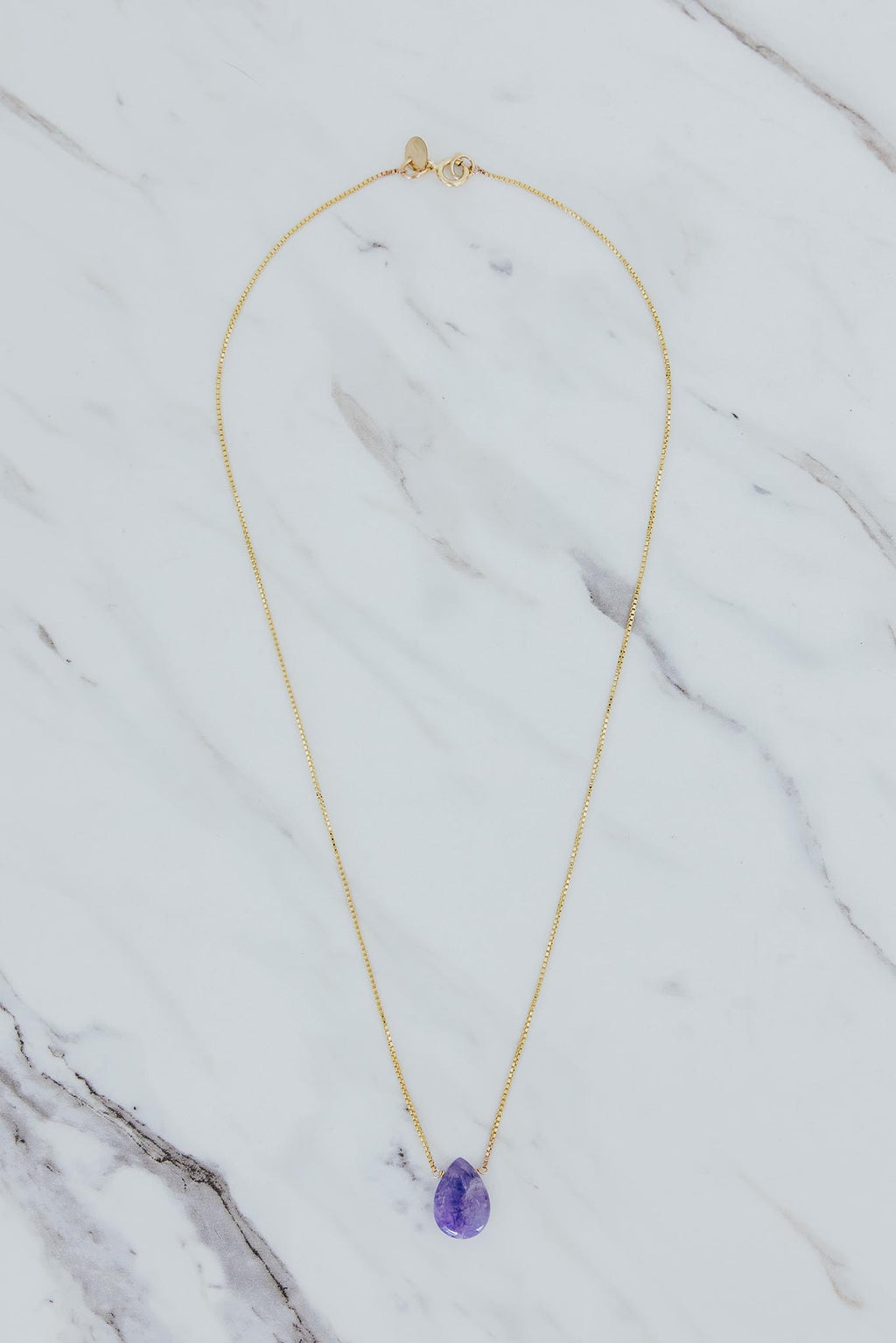 Wings Hawaii purple Hackmanite teardrop single stone necklace in 14k gold-filled. Fine jewelry handmade in Maui. 