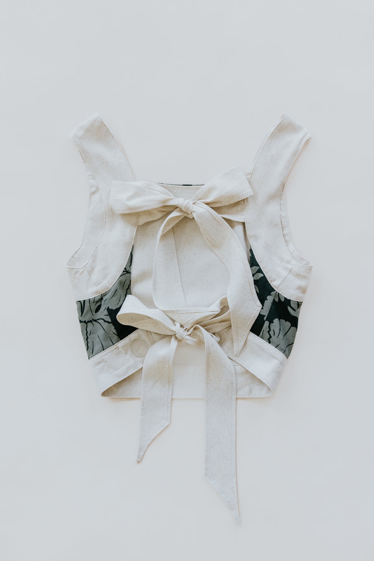 Wings Hawaii pinafore crop top in Hana Forest. Dark green aloha print hand-drawn and designed in Maui. small batch, sustainable, high quality women's apparel handmade with aloha. 