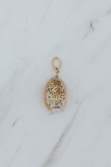 Wings Hawaii Honey Cowrie Shell necklace charms in 14k gold-filled. Fine shell jewelry handcrafted in Maui. Modern beachy charm necklaces handmade with authentic Hawaiian sea shells. 