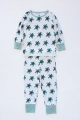 Wings Hawaii Honu kids pajamas set with sea turtles print. Original artwork designed in Maui. Island style keiki gifts. Long sleeved shirt with pajama pants. Small batch, sustainable, unique children’s apparel. 