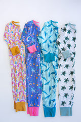 Wings Hawaii kids pajamas sets in rainbow, mermaids, whales, and sea turtle prints. Original artwork designed in Maui. Island style keiki gifts. Long sleeved shirt with pajama pants. Small batch, sustainable, unique children’s apparel.  thumbnail