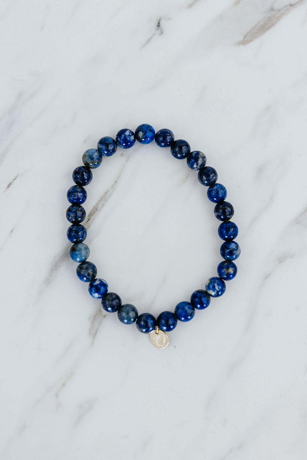 Wings Hawaii Lapis Lazuli stretchy beaded bracelet with 14k gold-filled tag. Crystal chakra healing. Boho-chic spiritual jewelry hand made in Maui.