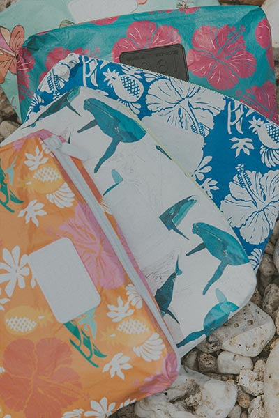 A collection of Wings Hawaii adventure pouches