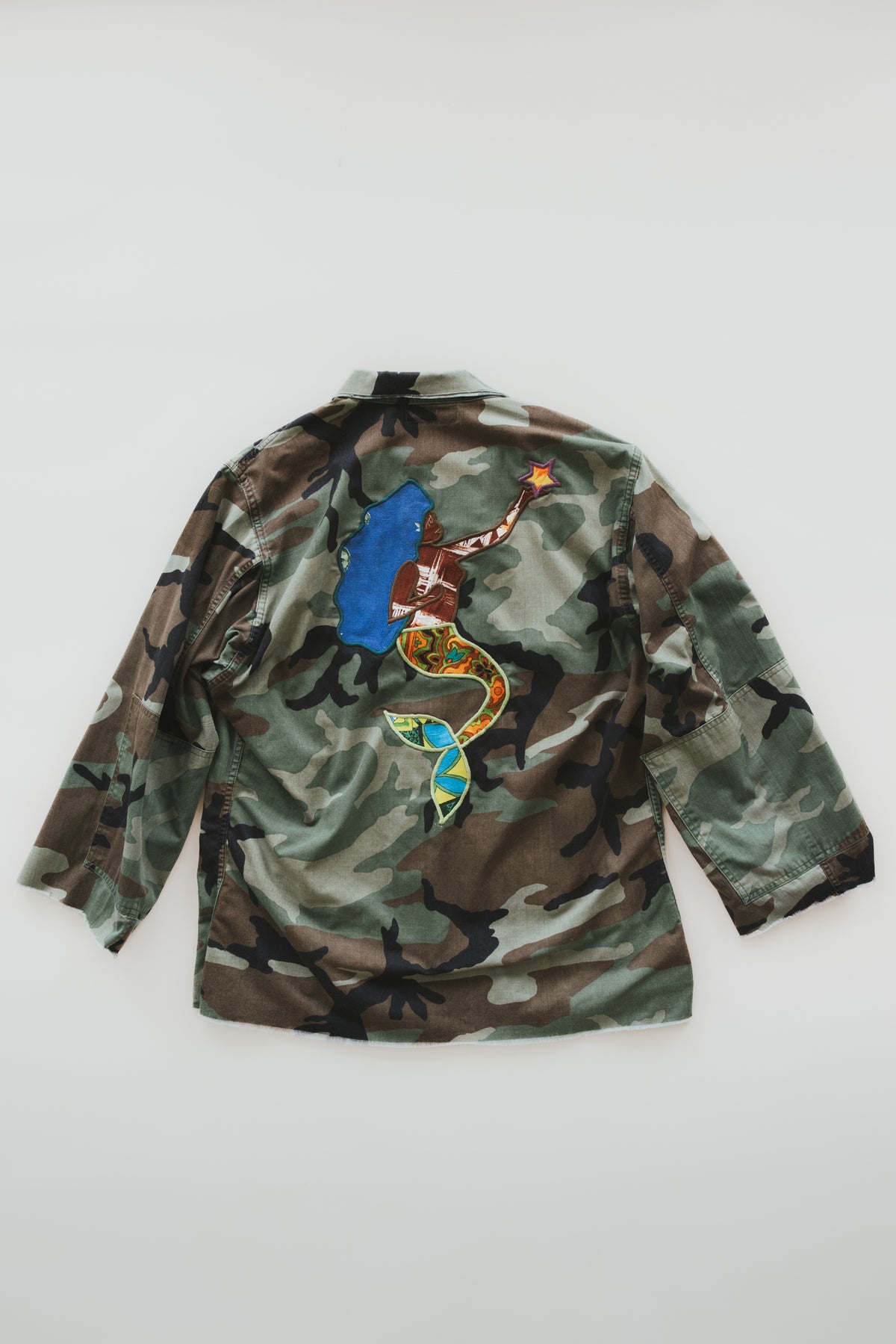 Wings Hawaii La Sirena mermaid army jacket. Handcrafted in Maui. Upcycled and hand-sewn with vintage aloha fabric. Small batch, sustainable fashion handmade in Hawaii.