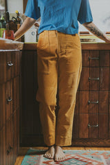 Model wearing Wings Hawaii retro pocket pants in marigold corduroy thumbnail