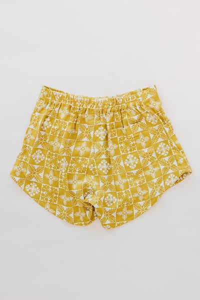 Wings Hawaii retro pocket shorts in quilted ulu and plumeria print in marigold - back 